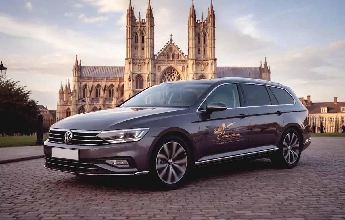 Branded Canterbury Airport Transfers estate car with Canterbury Cathedral behind